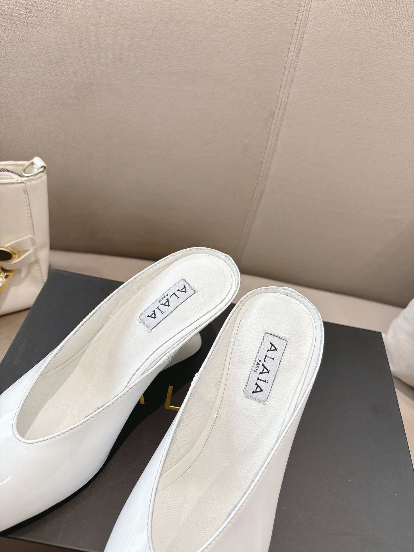 Alaia 25 Curve Wedge Mules White Lambskin 293554
