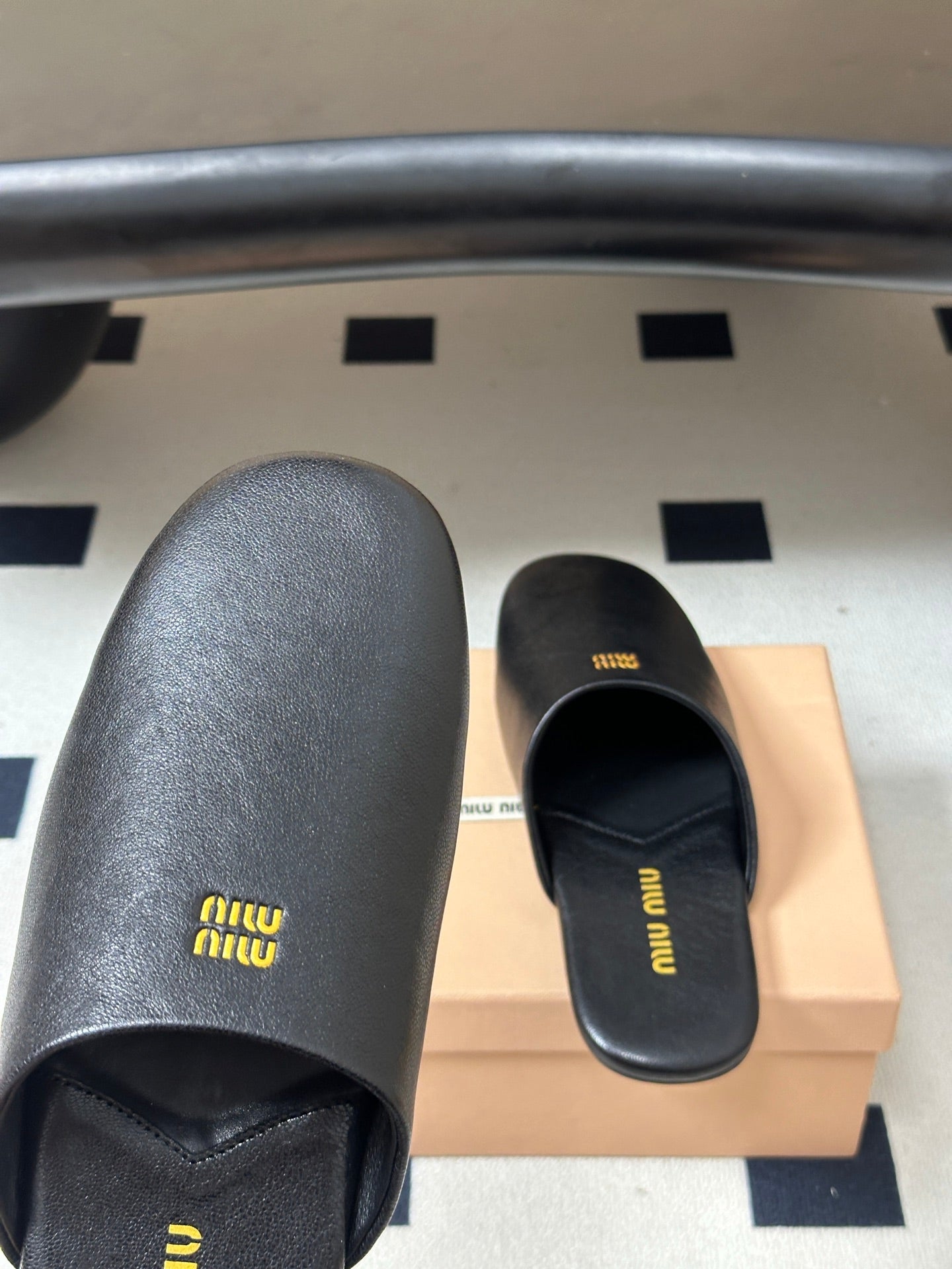 Miu Miu 2026 Flat Closed-Toe Mule Black Cowhide 994104