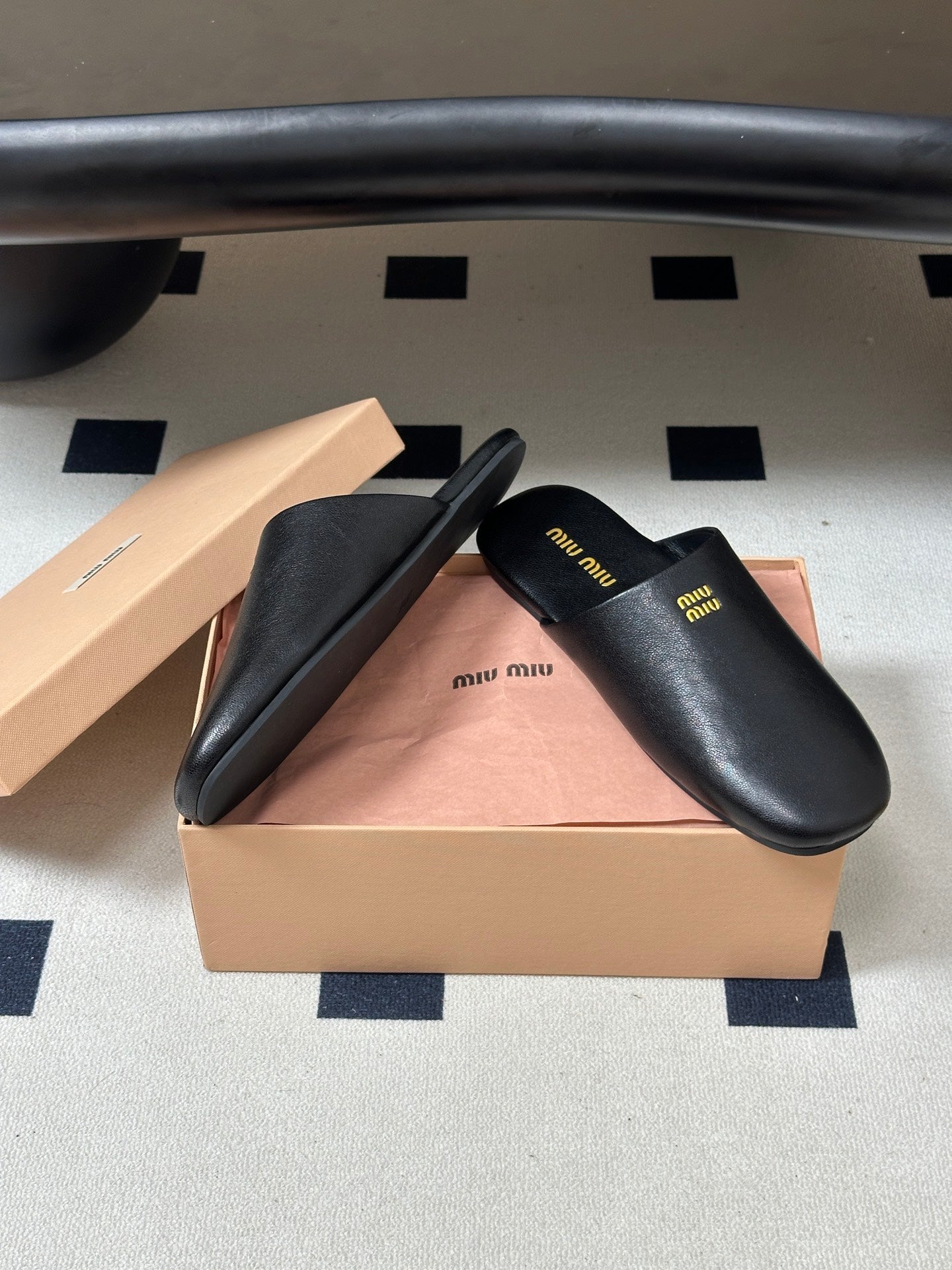Miu Miu 2026 Flat Closed-Toe Mule Black Cowhide 994104