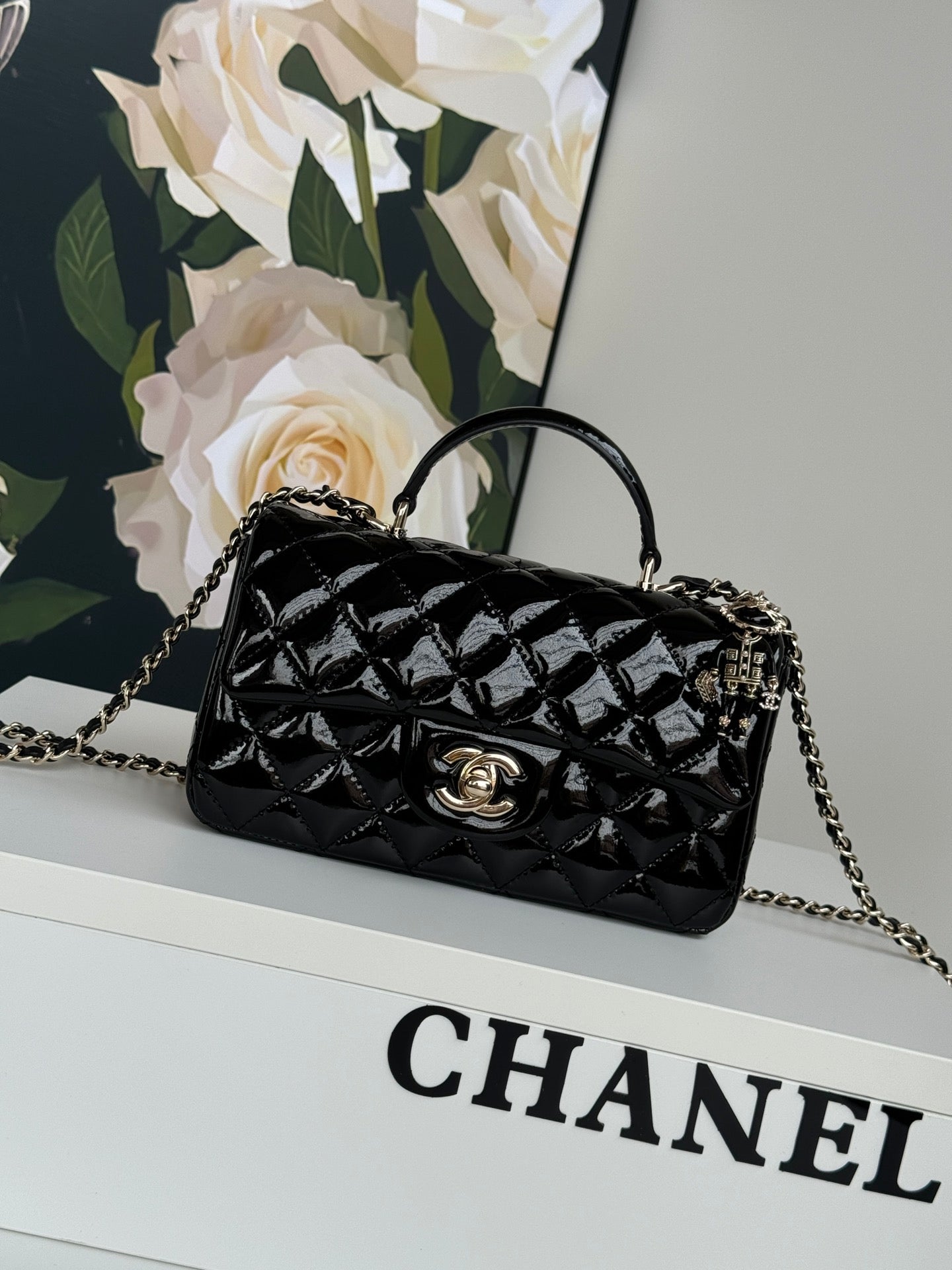24c mini flap bag 20cm with top handle black patent calfskin